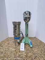 Front view of mixer with stacked stainless cups
