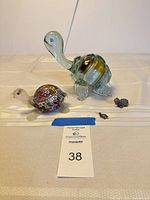 All four turtle figurines grouped for scale and overview