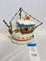 Full view of Miss Daisy boat figurine front and side