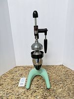 Front view of Hamilton Beach No. 32 juicer showing full unit and original cup