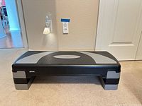 Front angled view showing platform and risers