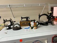 Group shot of all five sewing-related items on freezer top