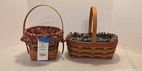 Both Longaberger baskets side by side showing shape, liners, handles