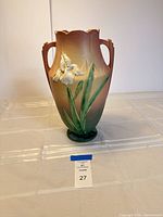 Front view of Roseville Iris vase showing raised flower and glaze