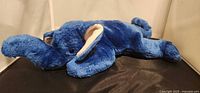 Left side view of royal blue Peanut Beanie Baby plush