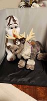 Olaf and Sven plush toys side by side