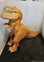 Full side view of Butch talking T-Rex figure