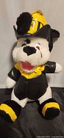 Front view of Dalmatian plush in firefighter outfit