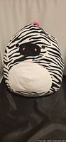 Front view of zebra plush showing face and body