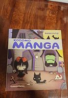 Front cover showing title Kodomo Manga Super Cute! and artwork