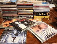 Stack of CDs showing covers and spines