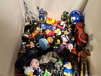 Top view of mixed toys piled in box