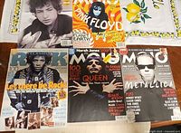 All five magazines laid out showing full covers