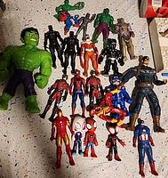 Full spread of assorted Marvel action figures on festive tablecloth