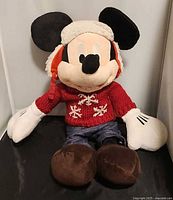 Front view of Mickey Mouse plush showing winter attire