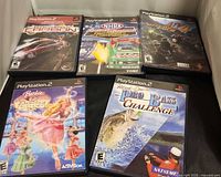 Front covers of all five PlayStation 2 game cases