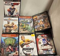 Seven PS2 game cases front view