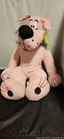 Full view of pink Scooby-Doo plush seated