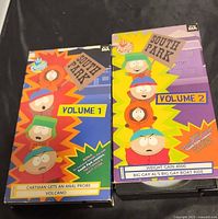 Front view of both VHS sleeves showing titles and artwork