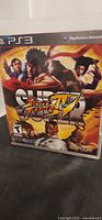 Front cover of PS3 Super Street Fighter IV case