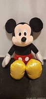 Front view of Ty Sparkle Mickey Mouse plush standing upright