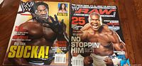Both magazine covers side by side showing titles and featured wrestlers