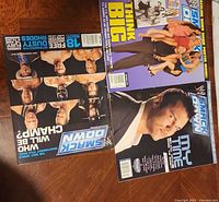Five magazines laid out showing covers