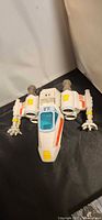 Top and front view of Hasbro X-Wing starfighter showing cockpit and wings
