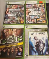 Front view of four Xbox 360 game cases