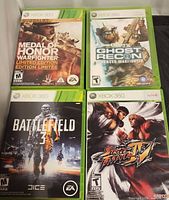 Front covers of all four Xbox 360 game cases