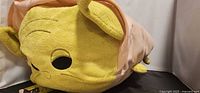 Front view of Yoda Tsum Tsum plush showing face and robe