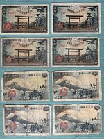 Fronts of all eight 50-sen notes, two distinct designs visible