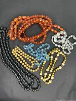 All six bead necklaces laid out for overview