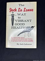 Front cover showing title, author, photos and minor wear