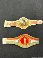 Two cigar bands close-up: Continental motif and La Flor Especial