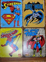 Front view of all four comic metal signs