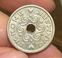 Obverse showing ornamental swirl and denomination