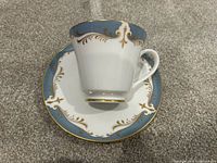 Teacup on saucer front view showing pattern