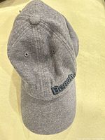 Front view showing grey cap and embroidered Bench logo
