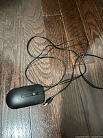 Top view of Dell wired mouse and USB cable