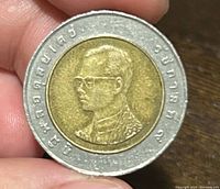 Obverse view showing King Bhumibol Adulyadej portrait and Thai legends