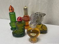 Front view of all five Avon fragrance bottles
