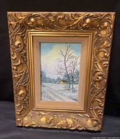 Full view of ornate gold frame and painting