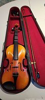 Violin in open case with bow