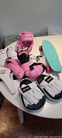 All martial arts gear and skateboard grouped on table