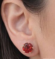 Earring worn on ear showing size and style
