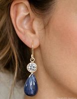 Earring worn on ear showing size and drop style