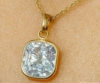 Pendant on chain showing diamond and bezel