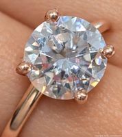 Close-up of solitaire moissanite and prongs