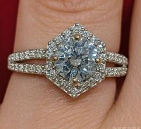 Front view of ring on finger showing hex halo and split shank